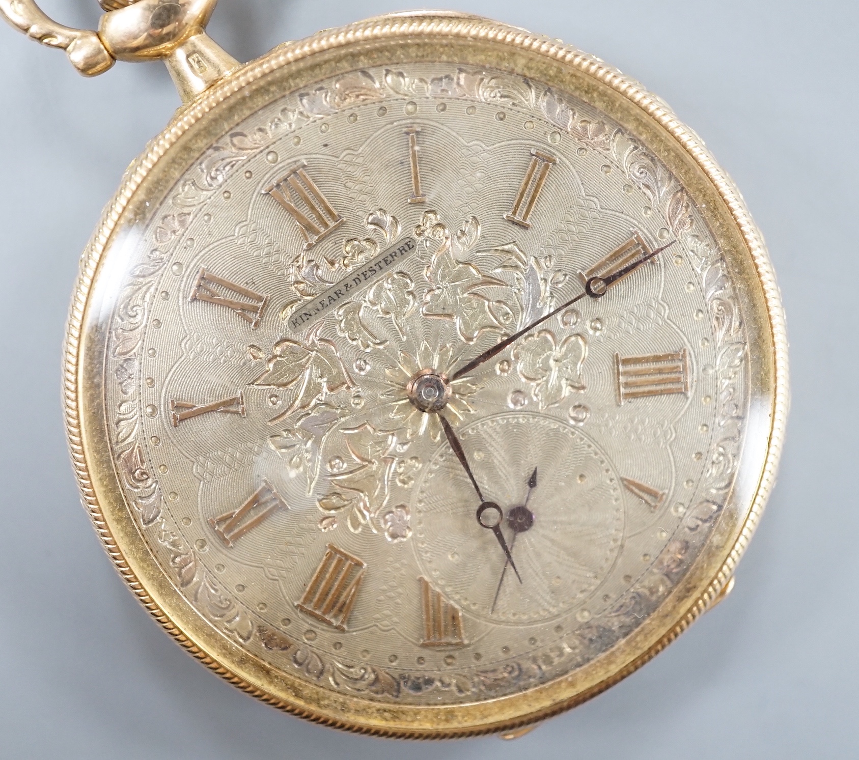 An early 20th century Swiss yellow metal open faced keyless dress pocket watch, retailed by Kinnear & D'Esterre, case diameter 44mm, gross 52 grams.